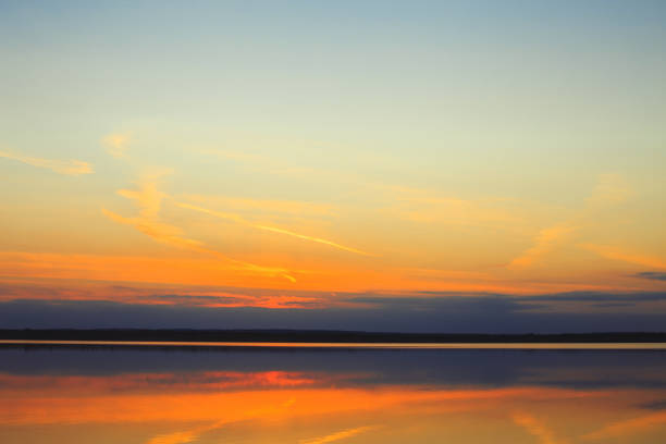 Reflection of a beautiful golden sunset over the water