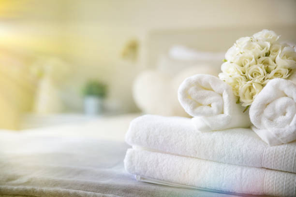 istock Set of clean white towels on bed 1396826954