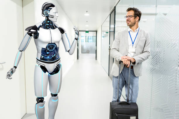 Humanoid robot assists company visitors stock photo