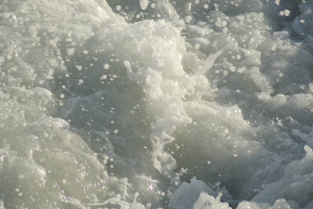 istock Rough waves sea with white foam at sunset 1396827206
