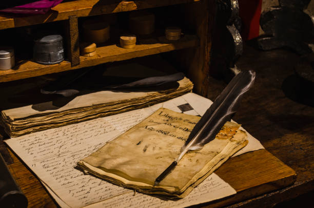 Recreation of an antique desk with a quill on parchments
