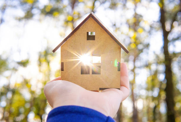 istock Sun shining through a toy house window outdoors 1396830356