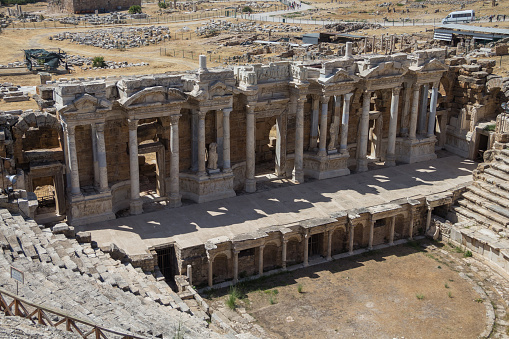 Turkey, Denizli, 29.08.2021: Roman antique amphitheater in Hierapolis, Turkey. Ruins of the Colosseum. Statues and columns made of marble. Travel in Turkey.