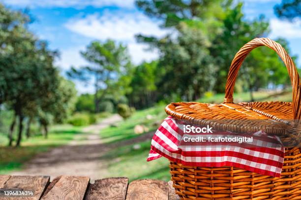 Picnic Basket On Wooden Table Outdoors Copy Space Stock Photo - Download Image Now - Picnic Basket, Tablecloth, Closed