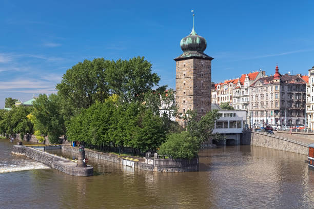 Prague, Czech Republic. Sitkov Water Tower on Vltava River at Masaryk Embankment. Originally a wooden tower, it was built in 1495. The stone tower was built in 1588-1591 and rebuilt in 1651.