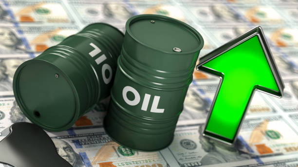 Oil Prices Moving Up Concept with US Dollar Stack Barrels and Green Arrow stock photo