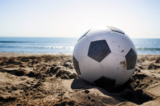 istock soccer ball on the beach 1396835844