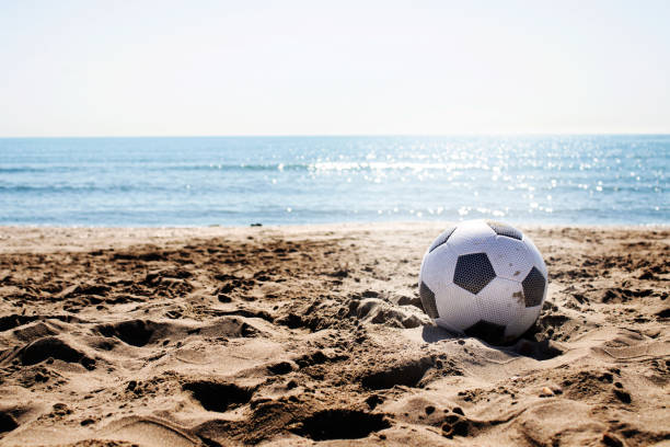 istock soccer ball on the beach 1396835845
