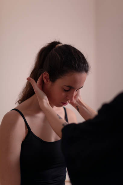 istock A woman therapist examines her patient's neck 1396837914
