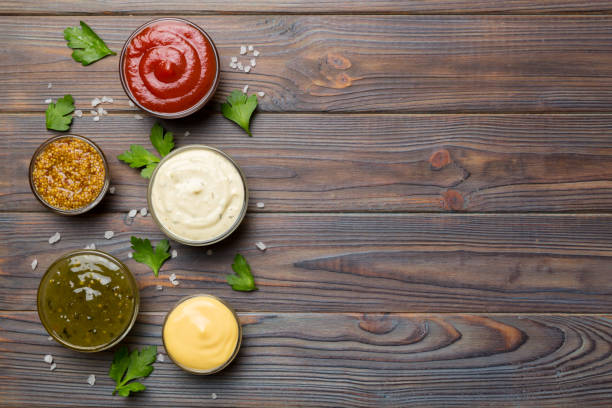 istock Many different sauces and herbs on table, flat lay top view. sauces with spices healthy concept 1396840383