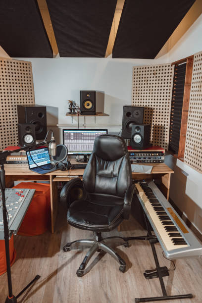 istock Interior of a sound engineer workplace for broadcasting. Music rehearsal space with drum kit and musical equipment. 1396841771