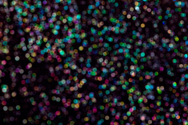 istock glitter wallpaper. Black background with sparkling glitters 1396843285