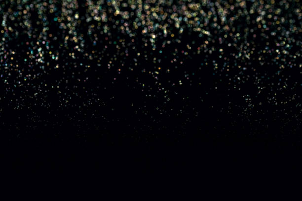 istock glitter wallpaper. Black background with sparkling glitters 1396843434