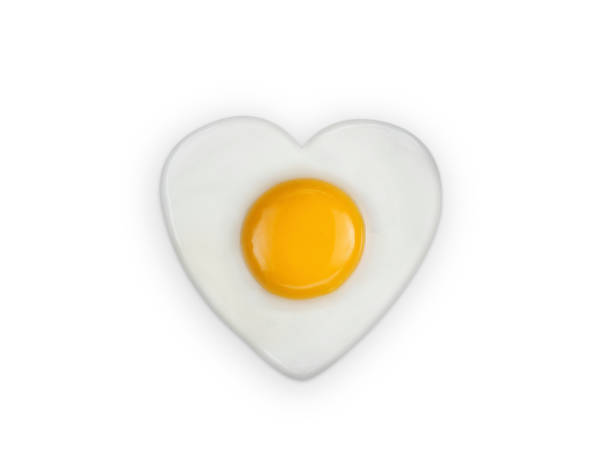 istock Heart-shaped omelet  fried egg isolated on white background 1396844650