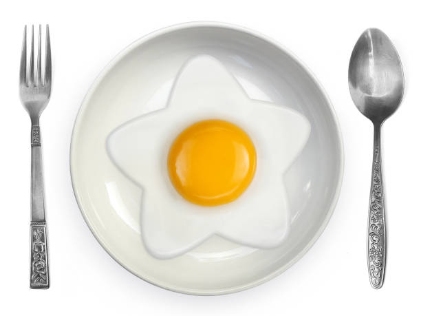 istock Star-shaped omelet  fried egg on ceramic plates isolated on white background 1396845971