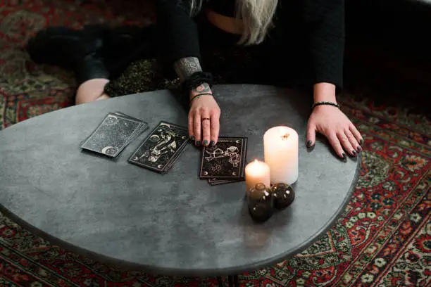 Photo of Unrecognizable Fortuneteller With Cards