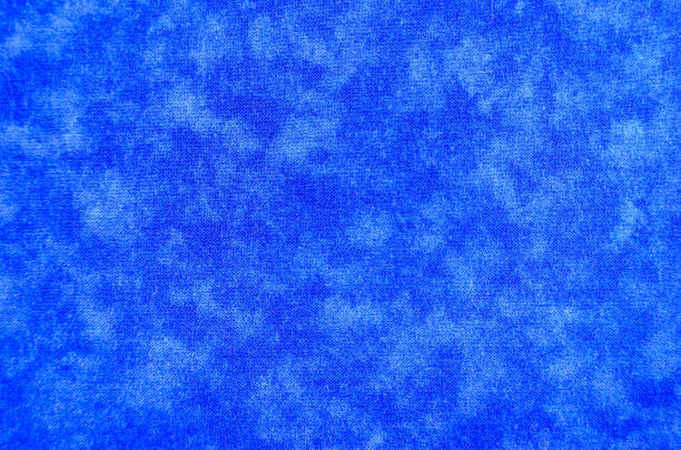 istock Abstract textured background in blues and whites 1396847578