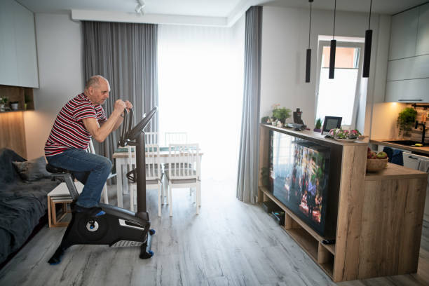 istock Senior man exercising at home 1396853074