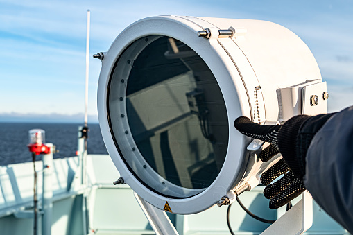 The communications mast of HMAS Sydney, a Hobart Class destroyer of the Royal Australian Navy.  She is docked at Garden Island naval base in Sydney Harbour.   This image was taken on a sunny afternoon on 11 November 2023.