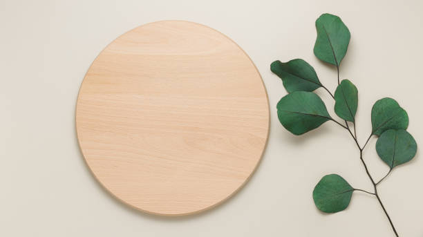 istock Round wooden showcase or podium with eucalyptus leaves 1396857293
