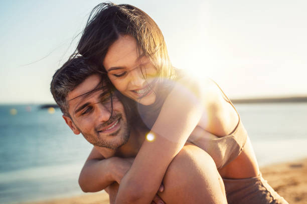Portrait of lovely couple in love having fun on the beach. Young beautiful people hugging . Romantic moment. Valentine's day. Portrait of lovely couple in love having fun on the beach. Young beautiful people hugging . Romantic moment. Valentine's day. Honey moon. sexy human beings stock pictures, royalty-free photos & images