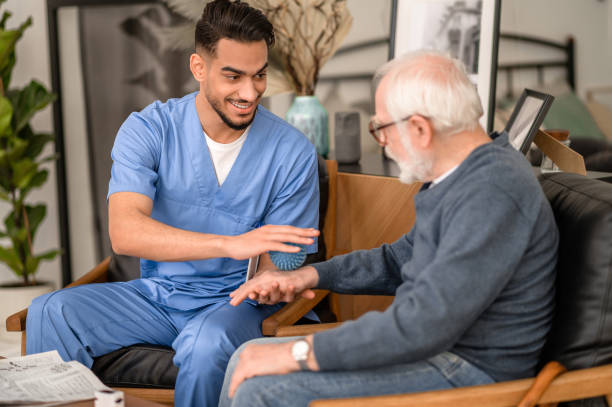 istock Physiotherapist using a spiky massage ball during the rehabilitation session 1396861220