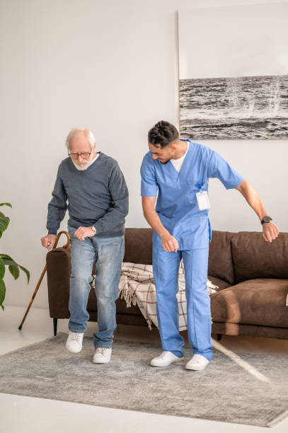 istock Concentrated elderly patient exercising with his physiotherapist 1396861232
