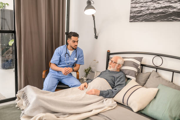 istock Physician examining a bedridden patient during the home visit 1396861249