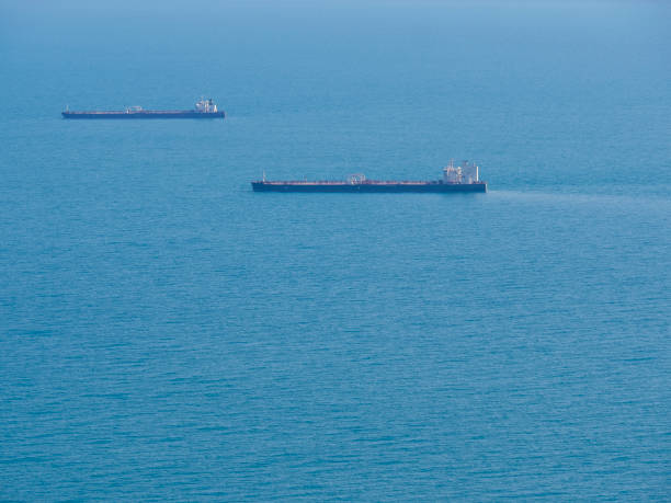 istock Two empty tankers in the blue sea. 1396861447