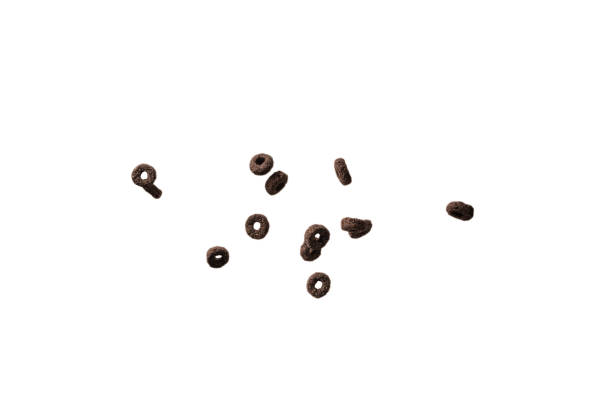 istock Chocolate rings cereal spill out into a bowl. Breakfast. 1396862345