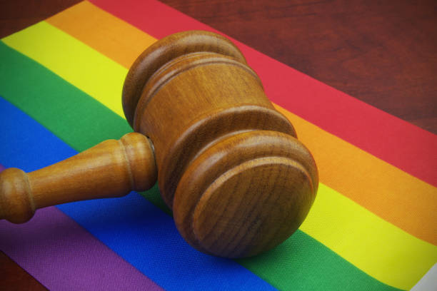 istock Judge gavel on LGBT pride flags. 1396863353