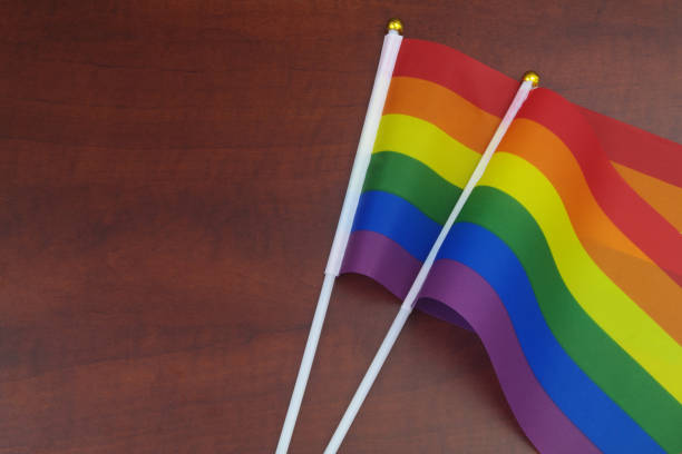 istock LGBT pride flags on wooden background 1396865186