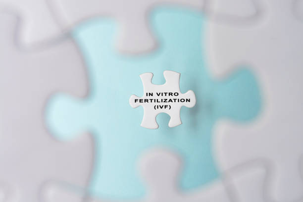 istock In Vitro Fertilization IVF word on puzzle pieces isolated on blue background. 1396867053
