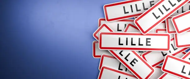 Multiple Lille city-limit signs on a heap. Lille is located in the Nord department, France. The typical white city limit sign with a red border for French cities.