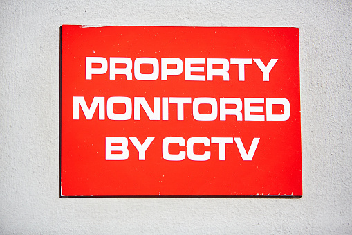 Warning sign in red and white announces that closed-circuit television is in use.