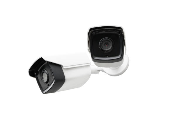 istock Modern public CCTV camera on wall isolated on white background. Intelligent reccording cameras for monitoring all day and night. Concept of surveillance and monitoring with clipping path copy space. 1396869526