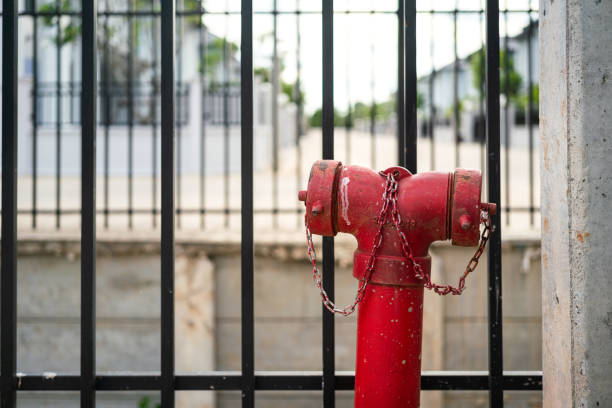 istock Red water hydrant head on the urban street. 1396871058