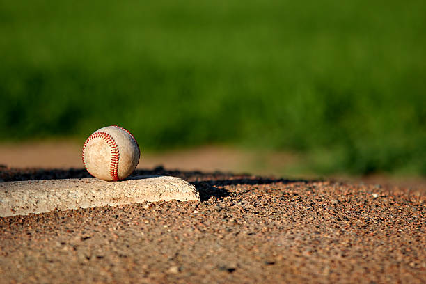 baseball on pitchers mound baseball closeup on the pitchers mound youth baseball and softball league photos stock pictures, royalty-free photos & images