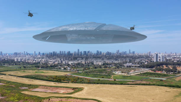 istock 3d rendering, Massive ufo Flying saucer hovering over large city Aerial view 1396874528