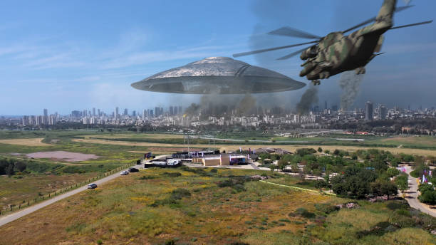 istock 3d rendering, Massive ufo Flying saucer hovering over destroyed city Aerial view 1396874549