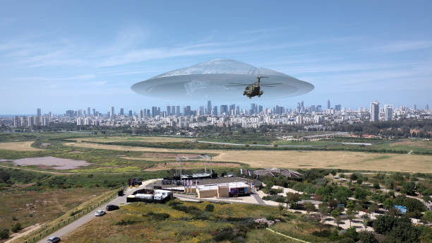 istock 3d rendering, Massive ufo Flying saucer hovering over large city Aerial view 1396874550