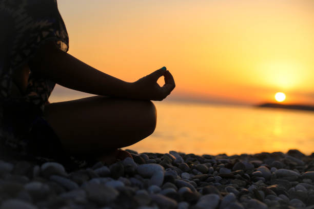 istock Yoga on the beach 1396874709