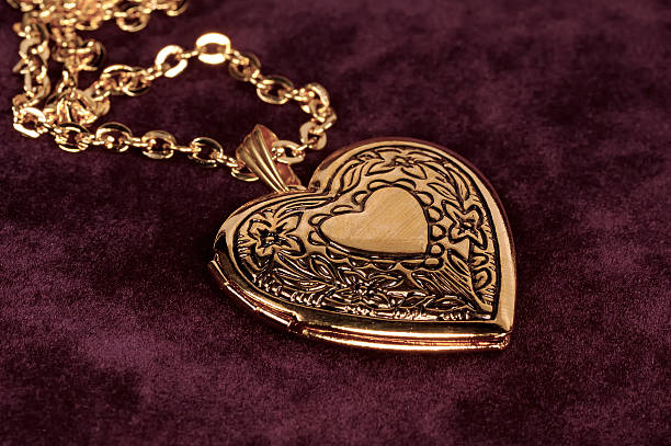 Gold Locket Gold Heart Shape Locket locket photos stock pictures, royalty-free photos & images