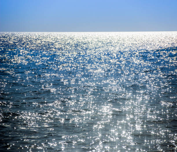 istock a sunlight on sea surface at bright day, Azov sea, Ukraine 1396875959