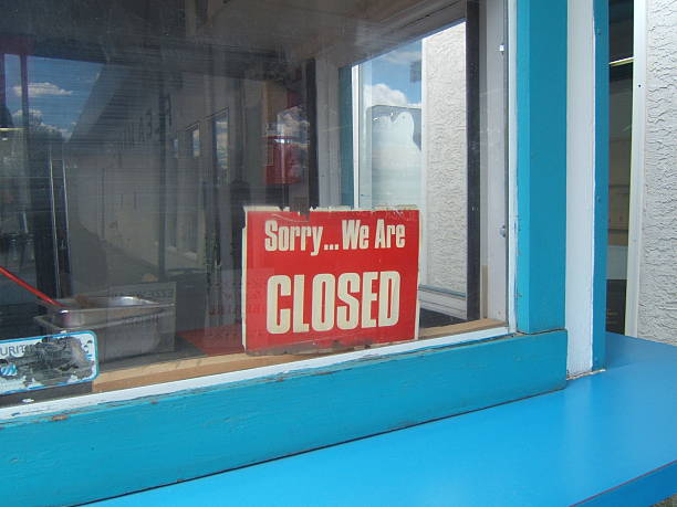 istock A red closed sign in the window of a blue building 139687601