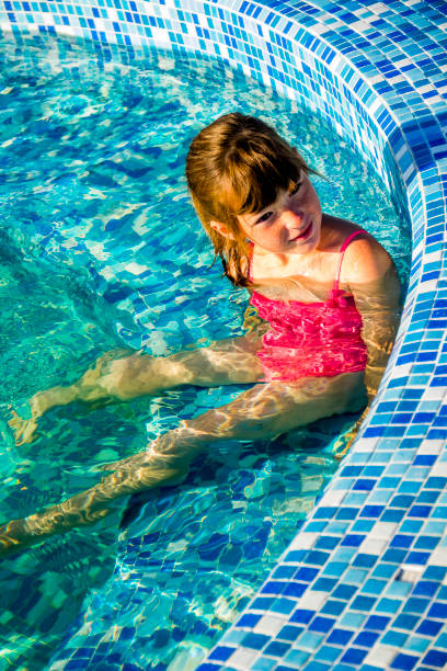 istock little girl in blue swimming pool 1396876095