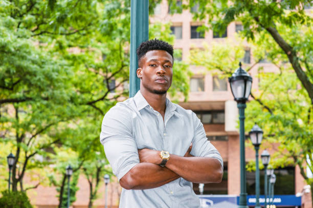 istock Young black man standing outdoors in New York City 1396879685