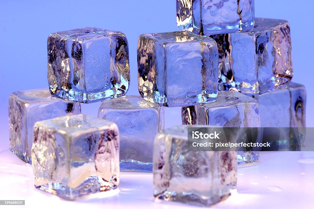 Ice Cubes Ice cubes against blue background. Abstract Stock Photo