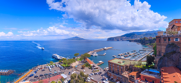 The little town of Sorrento sits amid lemon and orange groves on the south side of the Bay of Naples, surrounded by craggy cliffs that rise 55 meters above the sea. Sorrento is worth a stop for its laid-back holiday air, beaches, and its old streets lined by noble houses.