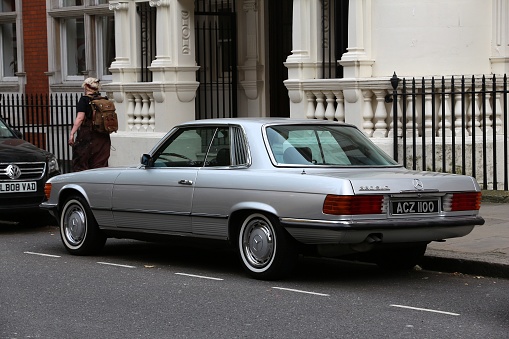 Classic Mercedes SL (R107) luxury coupe car parked in London, UK. There are 2.6m cars registered in London.